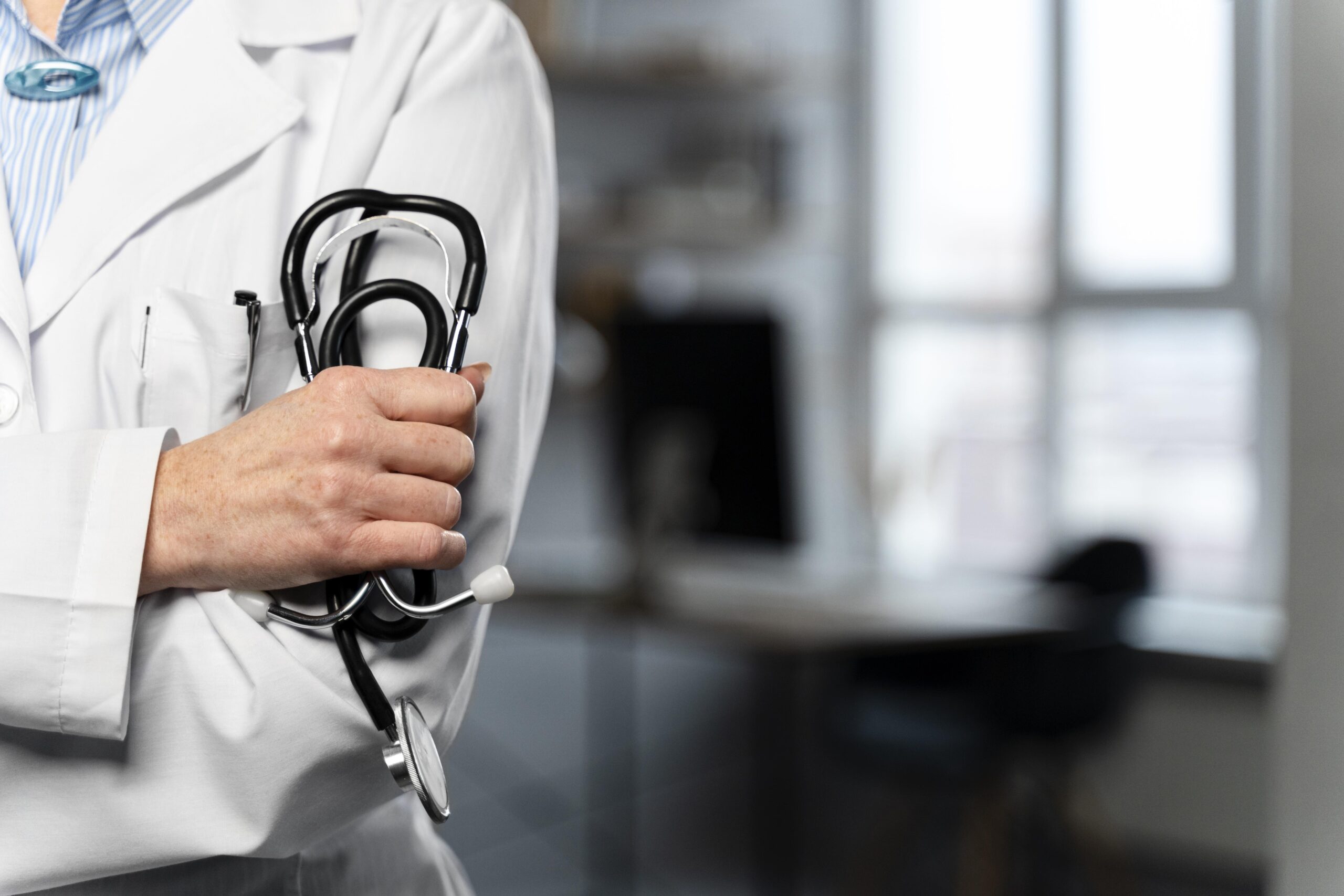 front-view-female-doctor-holding-stethoscope-with-copy-space